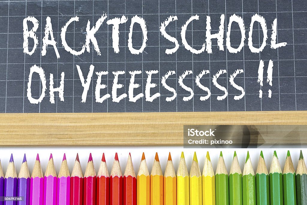 Welcome back to school Welcome back to school written on a blackboard Pencil Stock Photo