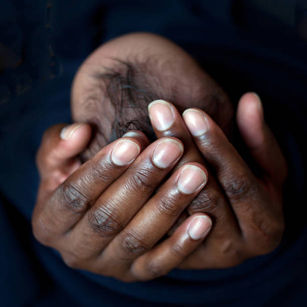 istock Black father holding newborn baby 506192563