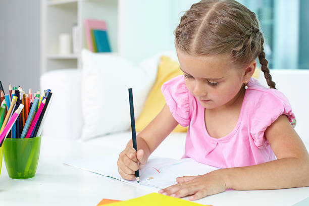 istock Girl with crayons 506194063