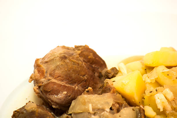 istock Tasty Pork cheeks with potatoes 506194384