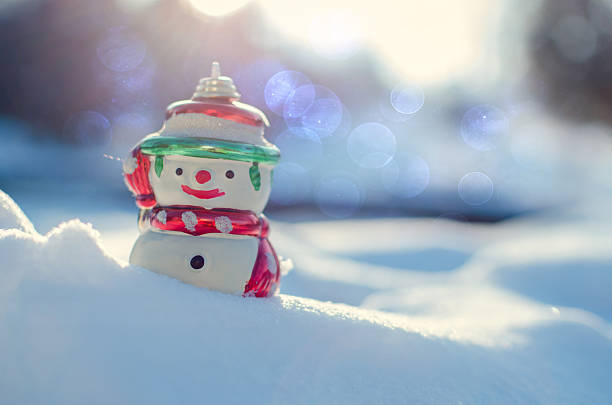 istock Winter concept with snowman on snow background. 506198764