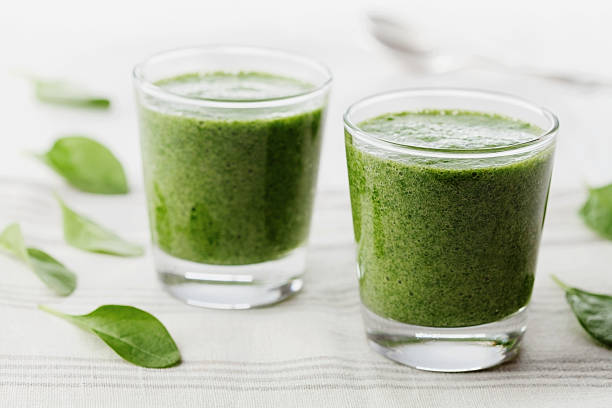 istock Organic cocktail or smoothie from spinach in glasses 506201810