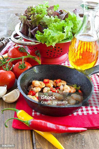 Garlic Shrimps With Chili Peppers Stock Photo - Download Image Now - Cast Iron, Checked Pattern, Chili Pepper