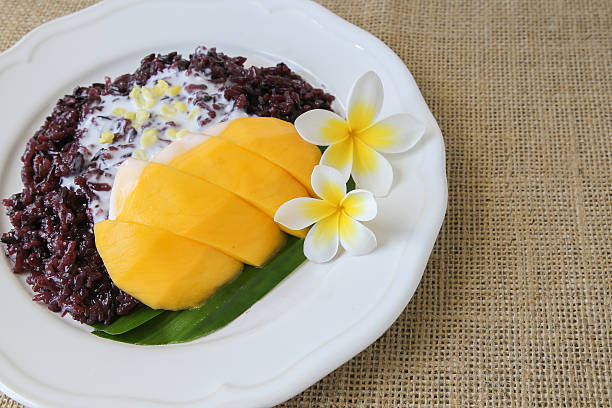 Homemade coconut black sticky rice with mango, selective focus