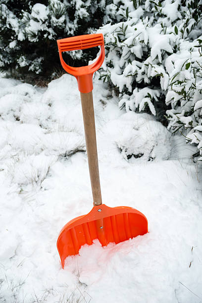 istock Orange shovel for snow removal 506216128