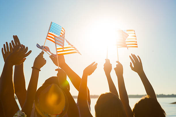 istock Crowd of waving American flags. 506216826