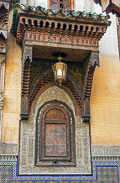 Arabesque pattern carved in entrance of Al Attarine madrasa in Derb Rhabt Qais, Fez El Bali Medina. Fez, Morocco. North Africa.