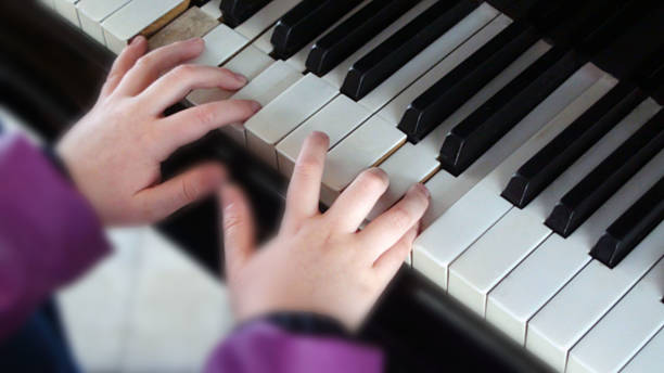 istock Hand Playing Love Songs With Piano Keyboard Inside Room 506217382