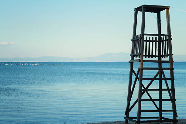 istock Old, wooden Safeguard's tower on the beach 506218052