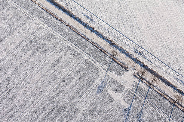 istock aerial view  over the harvest fields in winter 506218652