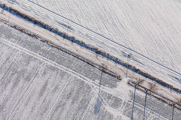 istock aerial view  over the harvest fields in winter 506218734