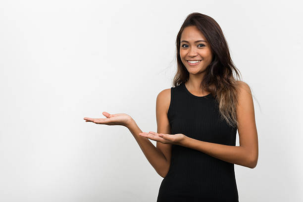 istock Asian woman presenting 506218882