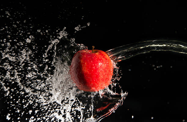 Water splash and apple stock photo