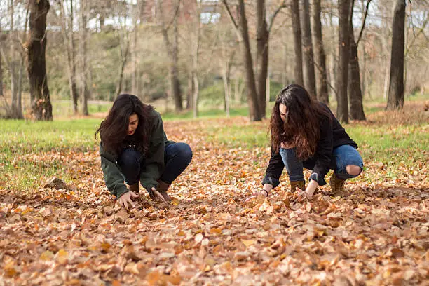 Photo of Two girls enjoying in the countryside in autumn.