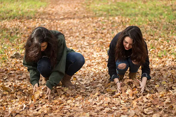 Photo of Two girls enjoying in the countryside in autumn.