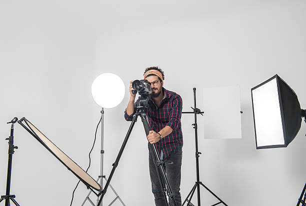 istock Portrait of smiling photographer with medium format camera 506220436