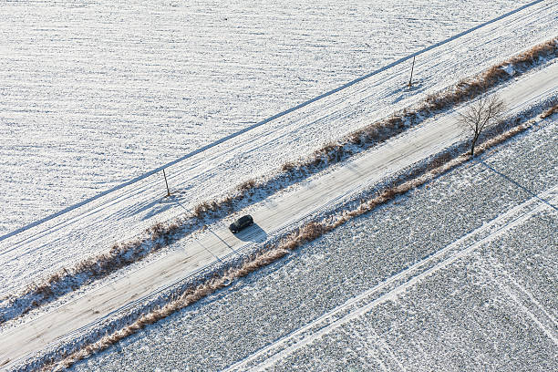 istock aerial view  over the harvest fields in winter 506220906