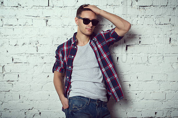 istock Casual handsome attractive hipster guy man with sunglasses his hand 506221430