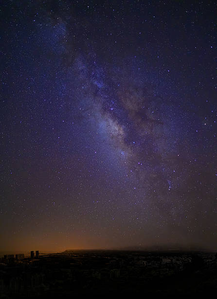 istock starry skies and the city 506221806