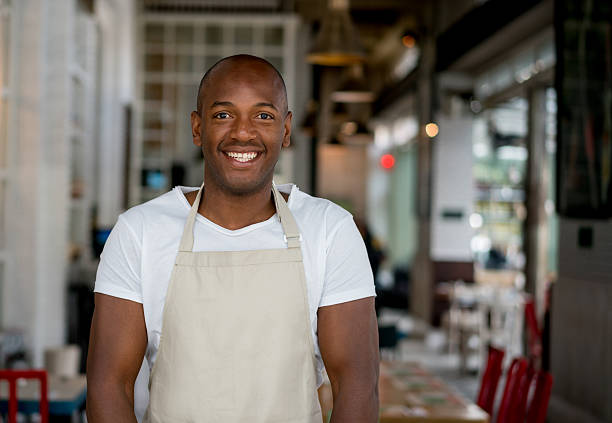 istock Happy waiter working at a restaurant 506237168