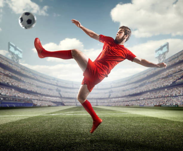 istock Soccer player kicking ball in stadium 506237960