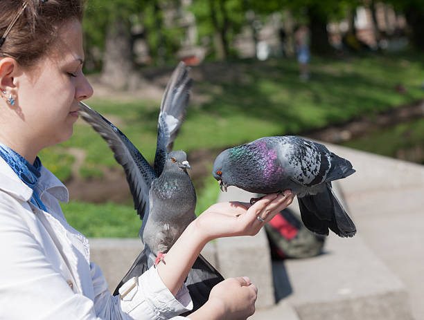 istock girl and two doves 506238934