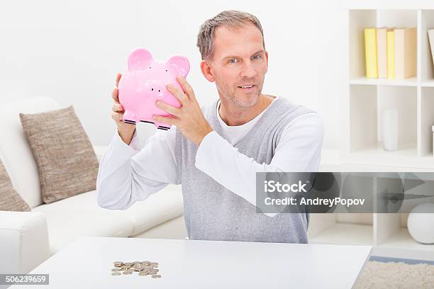 Man Holding Piggybank Stock Photo - Download Image Now - Adult, Adults Only, Business
