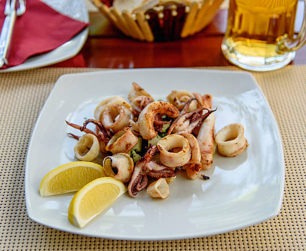 istock Fried squid stuffed with vegetables. Sea food 506239672