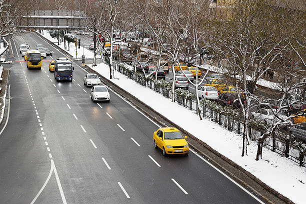 Manhattan, New York City, USA - January, 7.  Yellow taxi on Midtown Manhattan street after huge snowfall in New York City.