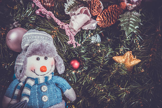 istock New year decoration with a snow man, toned, 506240380