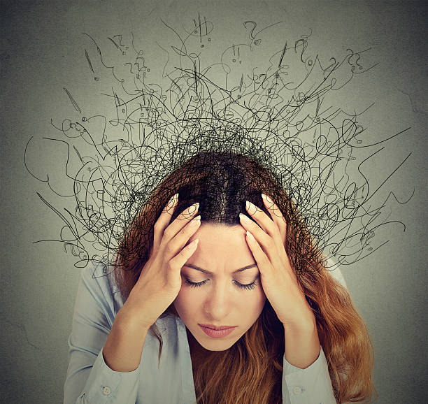 istock woman with stressed face expression brain melting into lines 506241128
