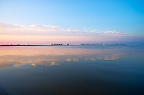 istock Clouds reflected in the waters of Saki salt lake . 506241976