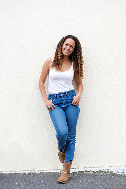 istock Smiling young woman posing outdoors 506242078