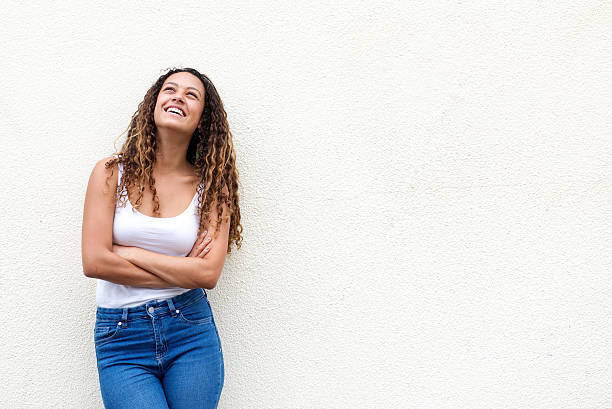 istock Relaxed young woman looking up smiling 506242836