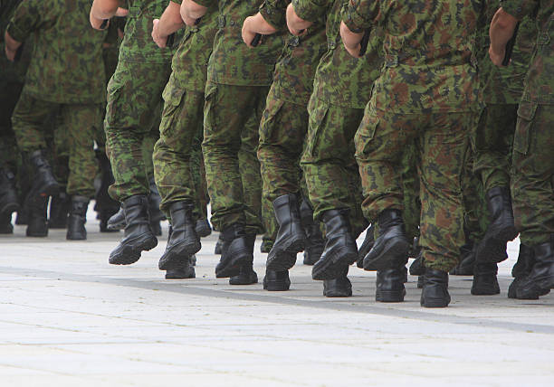 istock Soldiers march in formation 506243049