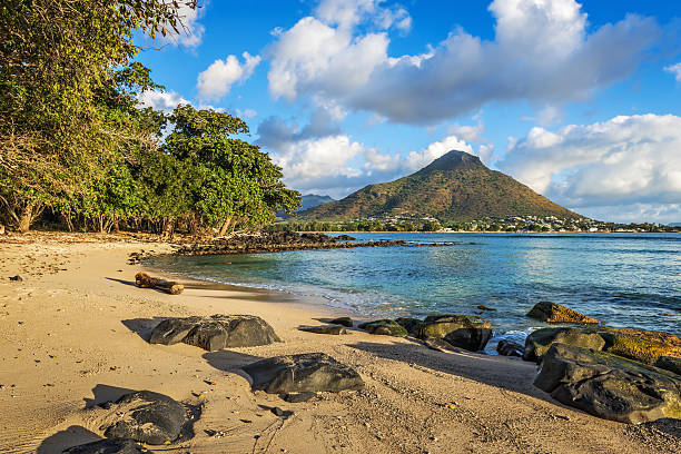 Rocky and sandy shore in Tamarin Bay stock photo