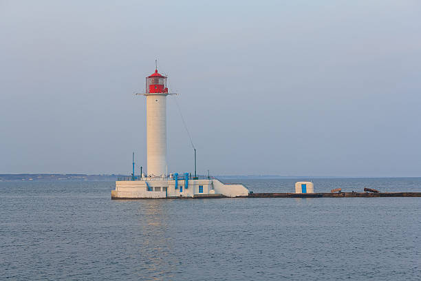 istock White lighthouse, the sea and coastline. Odessa, Ukraine 506243894