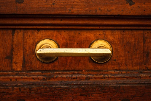 Old brass door late with brass door knob from Italy