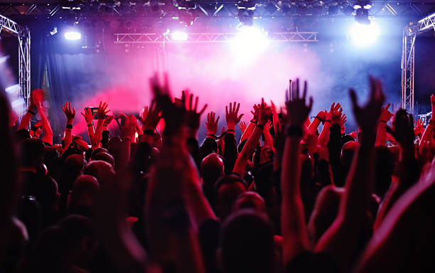 concert crowd silhouettes of people on a rock concert raising hands heavy metal stock pictures, royalty-free photos & images