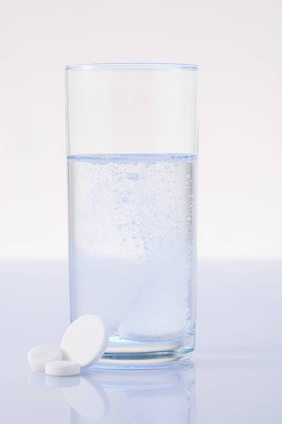 istock Glass of water mixed with pill 506244758