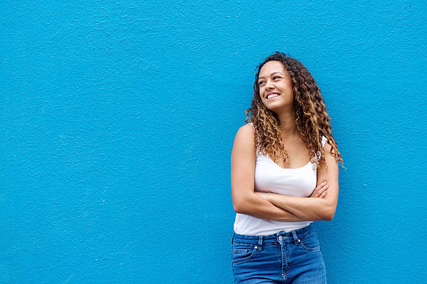 istock Relaxed young woman  smiling with arms crossed 506244980