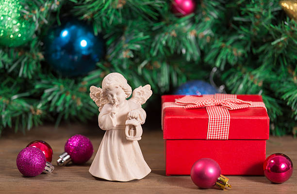 istock Wooden statue at christmas background with gift box 506245058