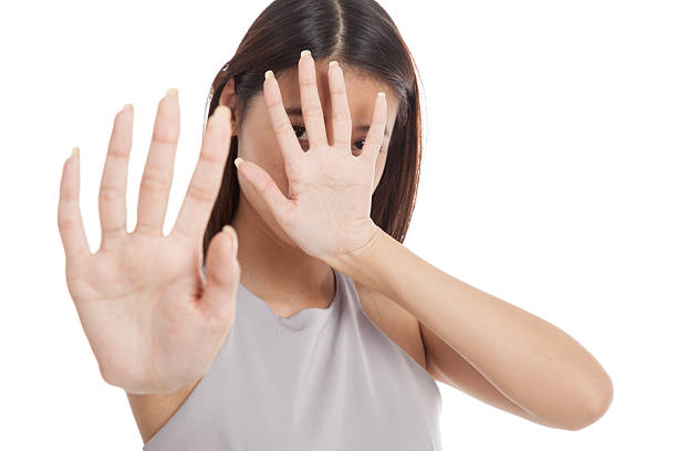 istock Young Asian woman  hide her  face 506245892