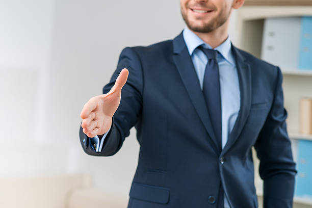 istock Positive office worker welcoming you 506246252