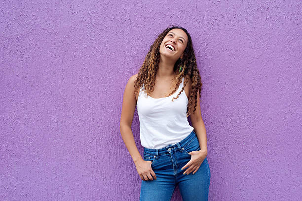 istock Young woman smiling looking up 506246344