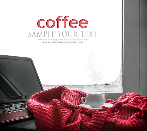 istock cup of hot coffee and a laptop for work 506246358