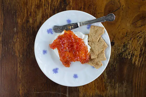 Red Hot Pepper Jelly on Plate with Cream Cheese and Crackers