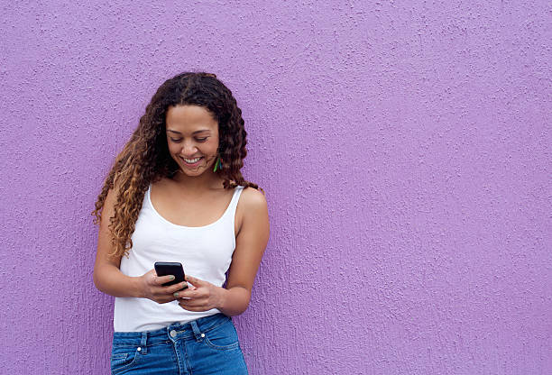 istock Woman reading a text message on mobile phone 506249200