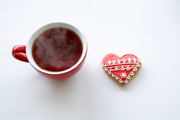 istock tea cup with sweet heart shaped cookie 506249298