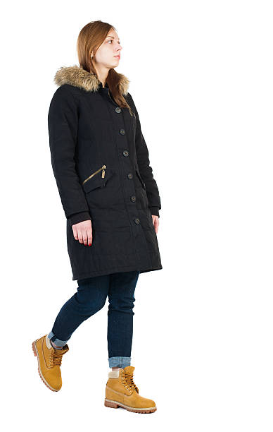 istock Back view of going  woman in parka. 506249308